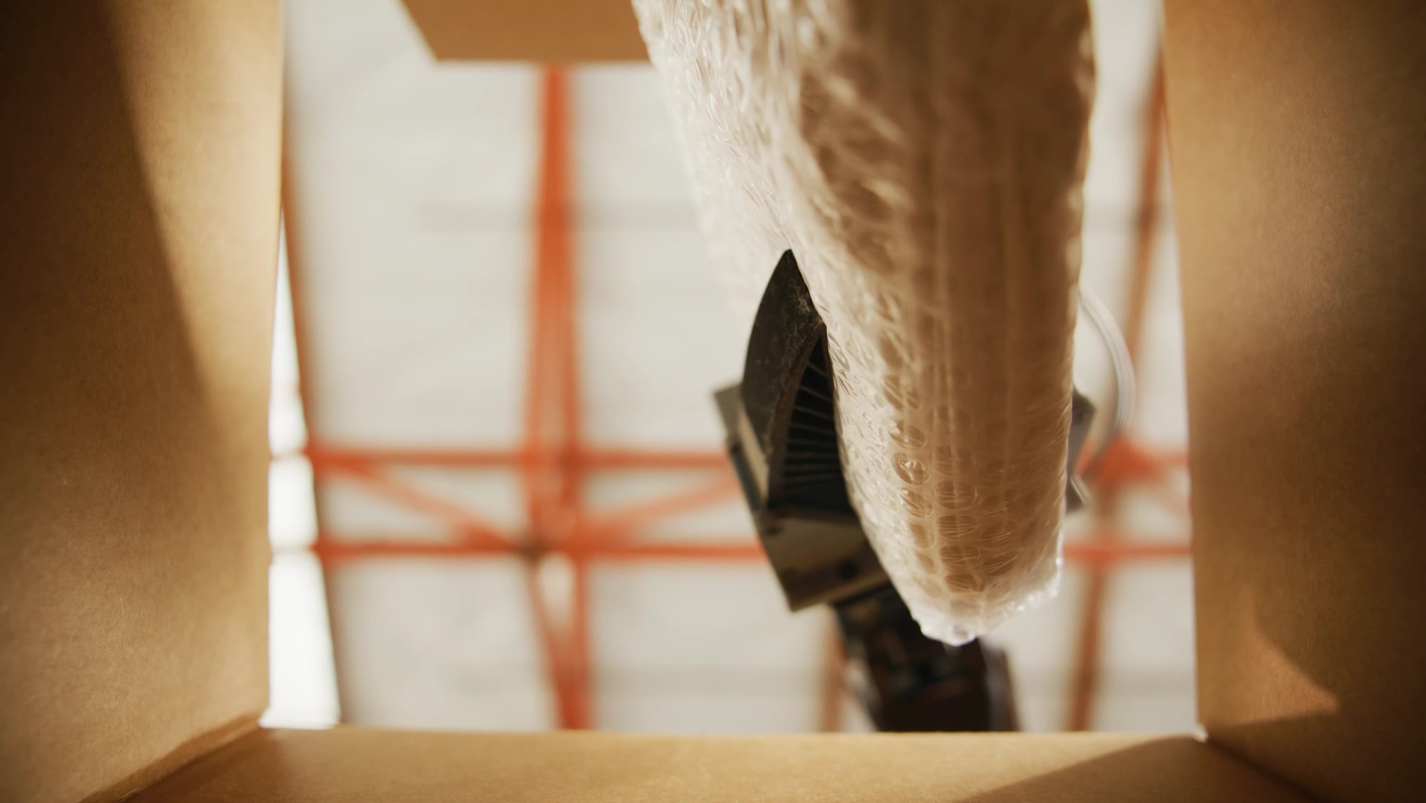 Looking up out of a shipping box at the gripper